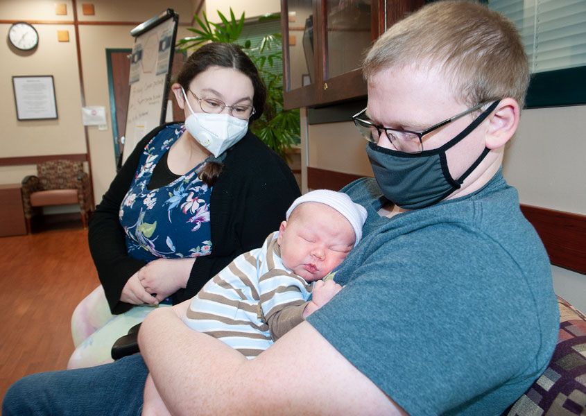 Rusty Rae/ News-Register ## 
Chasey and Scott Branton of McMinnville prepare to take Conner home from Willamette Valley Medical Center Sunday afternoon. The couple s first child was born at 9:03 a.m. New Year s Day.