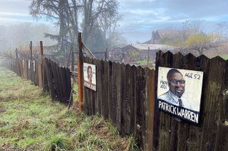 Rachel Thompson/News-Register##
Paintings of people who  died unjustly at the hands of those with power” line the fence bordering Eric and Annie Witherspoon s home on a rural road northwest of Yamhill. Annie started painting the portraits following the George Floyd case in 2020.