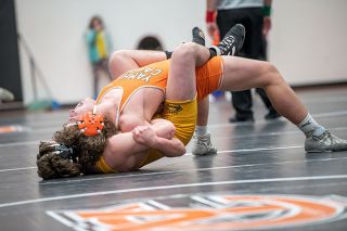 Rusty Rae/News-Register##After nearly being taken down from behind, Yamhill-Carlton’s Kaleb King pins Sheridan’s Jordan Brace with his back.