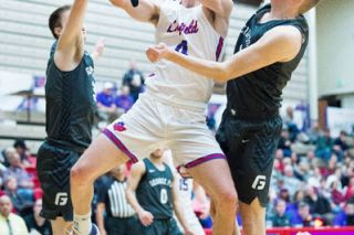 Marcus Larson/News-Register##
Linfield’s Dempsey Roggenbuck absorbs contact from George Fox defenders and finishes the lay-up during Saturday’s 107-83 Wildcat win. Marcus Larson/News-Register##
Linfield’s Dempsey Roggenbuck absorbs contact from George Fox defenders and finishes the lay-up during Saturday’s 107-83 Wildcat win.
