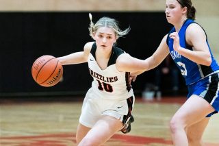 Marcus Larson/News-Register##
Lucy Angevine brings the ball up the court against McNary. Her leadership has been a steadying force for the young Grizzlies.