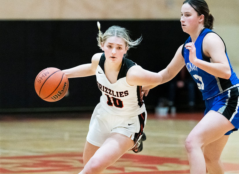 Marcus Larson/News-Register##
Lucy Angevine brings the ball up the court against McNary. Her leadership has been a steadying force for the young Grizzlies.