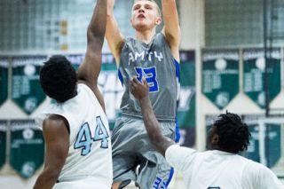 Marcus Larson/News-Register##
Amity forward Josh Wart rises for a short jumper against De Las Salle’s Traveon Johnson (44) and George Sadi (3). Marcus Larson/News-Register##
Amity forward Josh Wart rises for a short jumper against De Las Salle’s Traveon Johnson (44) and George Sadi (3).