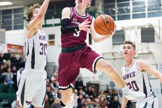 Marcus Larson/News-Register##
Dayton guard Lukas Findlay flies to the hoop for a contested lay-up against Horizon Christian’s Connor Zralka (30) and Kyle Free (20). Findlay and fellow starting guard, Braeden Nowlin, were held to a combined 13 points in the 55-46 loss. Marcus Larson/News-Register##
Dayton guard Lukas Findlay flies to the hoop for a contested lay-up against Horizon Christian’s Connor Zralka (30) and Kyle Free (20). Findlay and fellow starting guard, Braeden Nowlin, were held to a combined 13 points in the 55-46 loss.