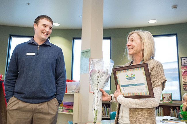 Marcus Larson/News-Register##
Wascher Elementary SMART coordinator JoAnne Myers is awarded Volunteer of the Year by Michael Finlay.