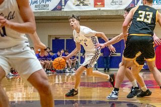 Rachel Thompson/News-Register##TreyVaughn Bierlink drives inside during Linfield’s 61-60 win over Pacific Lutheran. Bierlink finished with a career-high 13 points in the victory, including the game-winning three with 2.6 seconds remaining.