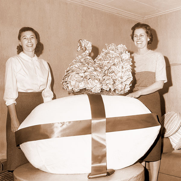(January 6, 1963)##Pat Miller (left) and Gretchen Davis pose with a turkey made of $1 bills--300 of them. The turkey was made as a display stunt to publicize the fact that Oregon turkey growers have raised their quota in donations to the National Turkey Federation.