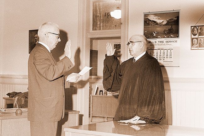 (January 6, 1963)##Famous Pair - Yamhill County’s two distinguished barristers got together at the county courthouse this week for a swearing-in ceremony. Eugene Marsh (left) is president of the Oregon State Bar Association. Judge Arlie Walker has spent more time on the bench than any other judge in the state, some 36 years.