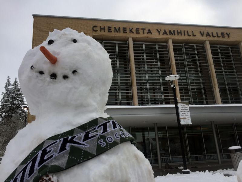 ##A snowman draped in a Chemeketa soccer scarf showing off its school spirit.