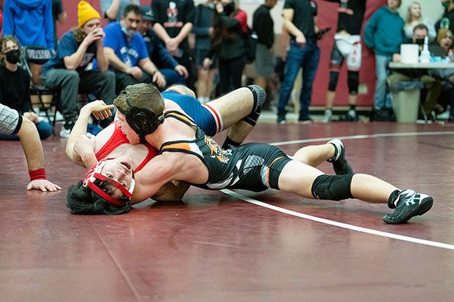 Marcus Larson/News-Register##
Yamhill-Carlton’s Caden Hill in the process of pinning an opponent in the semi-final round. He lost in the finals to finish second.