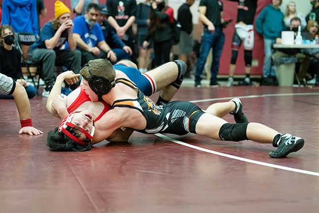 Marcus Larson/News-Register##
Yamhill-Carlton’s Caden Hill in the process of pinning an opponent in the semi-final round. He lost in the finals to finish second.