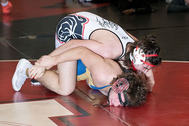 Rusty Rae/News-Register##
Lucien Lefebvre battles in his finals match. He went on to gain a win by a fall.