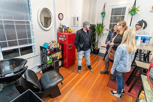 Marcus Larson/News-Register##Hair stylist Braxton Starr gives a tour of his studio, Parlor, to guests during an open house event Friday night. Parlor is located upstairs in the 400 block of Third Street.