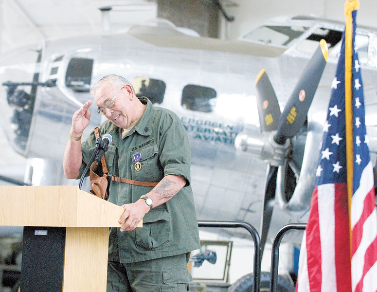 News-Register File Photo##Retired Marine “Gunny” Brandon signs off with a salute after his speech at a Veterans Day presentation at the Evergreen Aviation Museum. The retired gunnery sergeant loved wearing his uniform.