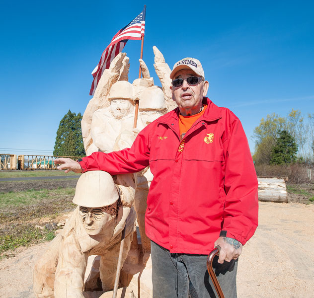 News-Register file photo##Gunny Brandon stands next to a wooden statue of the flag raising at Iwo Jima in this 2014 photo.