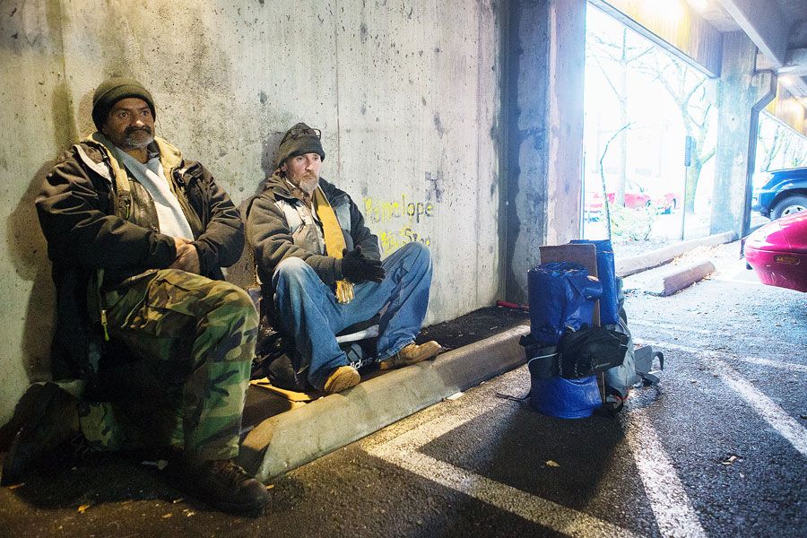 Jason, right, and his 56-year-old street pal, Mark, take an early morning break before heading out to seek aid and comfort from passing motorists. Mark is a former painter and welder from Idaho. The two have been hanging out together since meeting 18 months ago at a local shelter.