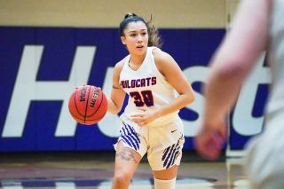 Submitted photo courtesy Nathan Herde##
Linfield junior guard Janessa Yniquez dribbles up court during Tuesday’s conference tilt against Pacific.
