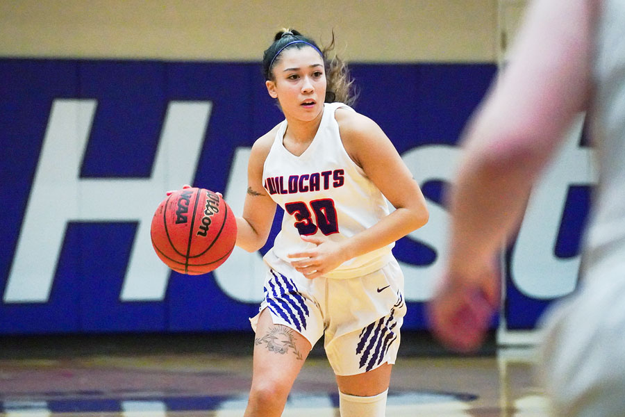 Submitted photo courtesy Nathan Herde##
Linfield junior guard Janessa Yniquez dribbles up court during Tuesday’s conference tilt against Pacific.