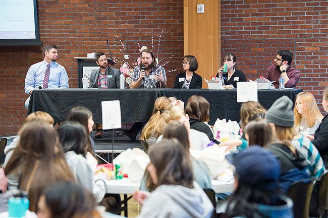 Marcus Larson/News-Register##
Mac High teacher Matt Brisbin, left, emcees a panel that includes CVCC director Sean Andries, Linfield professor Joe Wilkins, author Teresa Klepinger, librarian Courtney Terry and Oregonian reporter Eder Campanano.