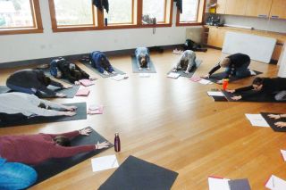 Starla Pointer / News-Register##
Angela Newport, at right, and students at the Fire Writers Conference stretch and breath in a class about yoga, mindfulness and writing. The day also included classes in poetry, writing tools and other topics. Starla Pointer / News-Register##
Angela Newport, at right, and students at the Fire Writers Conference stretch and breath in a class about yoga, mindfulness and writing. The day also included classes in poetry, writing tools and other topics.