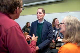 Rusty Rae/News-Register##
Senator Ron Wyden chats with McMinnville residents Jay
and Becky Pearson during a social session after his town
hall Friday, attended by about 100 people.