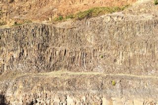 Submitted photo##View inside the Walnut Hill Quarry. The sheer cliff reveals the interior rock formation of the hill. Note the layers of three distinct volcanic events.