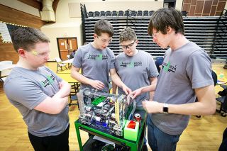 Photo submitted by Andrew Scholer
## Tyler Gallinger, Bryan Blank, Dylan DeForrest and Logan Shurts of the
> Chromobreak robotics team prepare for competition. Chromobreak teamed
> up with the other Mac High group, Ursa Mechanica, to win the
> qualifying event. Photo submitted by Andrew Scholer
## Tyler Gallinger, Bryan Blank, Dylan DeForrest and Logan Shurts of the
> Chromobreak robotics team prepare for competition. Chromobreak teamed
> up with the other Mac High group, Ursa Mechanica, to win the
> qualifying event.