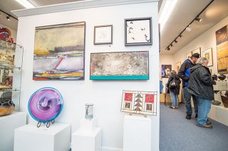 Marcus Larson / News-Register##
Art lovers browse offerings in the Currents Gallery show of works
collected  by Marilyn and the late Matt Worrix. Marilyn Worrix decided
she had to part with much of her beloved collection because she s moving
from a spacious apartment, once an Elks Lodge, into a small house in
McMinnville. More than 80 percent of the collection was snapped up
within two weeks.