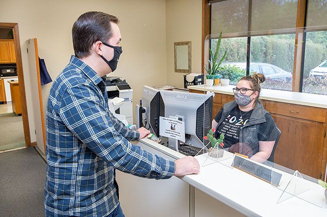 Marcus Larson/News-Register ## Jason John, chief operating officer, chats with receptionist Hannah Forster in the companies McMInnville office. Hagan Hamilton has been named one of Oregon s Top 100 employers more than a dozen times.