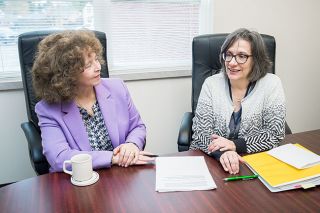 Marcus Larson/News-Register##
McMinnville School District Superintendent Maryalice Russell talks with
Susan Escure, director of finance, about the upcoming monetary issues.
Escure called Russell a tough, but supportive, boss.