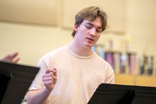 Rachel Thompson/News-Register
##T.J. Lake practices his part in a song for the Swingin’ on
a Star fundraiser scheduled for Saturday, Jan. 28. Lake, a
McMinnville High School senior, plans to pursue a career in
musical theater.