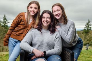 Rusty Rae/News-Register##Haley Vanderzanden enjoys moment of relaxation amidst her busy senior year at Amity High School. She loves spending time with her two best friends, sisters Tenley (left) and Riley.