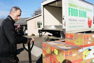 Submitted photo##YCAP Food Bank Programs and Logistics Coordinator Dave Rucker unloads perishable foods and fresh produce for FCI Sheridan workers. The partial federal government shutdown ended Friday, but affected families have yet to receive back pay.