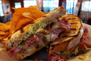 Courtesy Chehalem Valley Brewing Company## Grilled artisan sourdough bread with rosemary EVO, basil infused goat cheese, house smoked corned beef and Mama Lils Peppers served with Truffle Sea Salt Potato Chips or hand cut fries. 