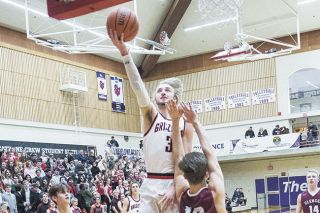 Rusty Rae/News-Register##
McMinnville wing Parker Spence rises for a lay-up attempt over Glencoe’s Nathaniel Takle during Wednesday’s Pacific Conference matchup at Ted Wilson Gymnasium. Spence scored a game-high 27 points to lead the Grizzlies to a 79-45 win. Rusty Rae/News-Register##
McMinnville wing Parker Spence rises for a lay-up attempt over Glencoe’s Nathaniel Takle during Wednesday’s Pacific Conference matchup at Ted Wilson Gymnasium. Spence scored a game-high 27 points to lead the Grizzlies to a 79-45 win.