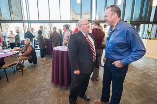 Marcus Larson/News-Register##McMinnville Mayor Scott Hill chats with the city Airport Commission’s Mark Fowle during a social hour before the annual State of the City speech.