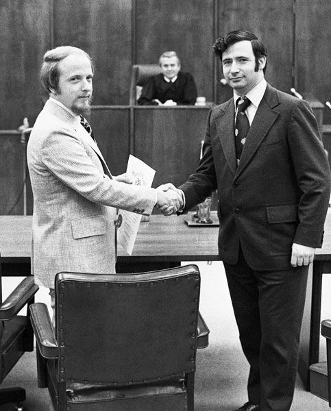 ##John Collins, left, is sworn in as District Attorney by Ed Sullivan, then-county legal counsel,
as former Circuit Judge Kurt Rossman looks on, in this January 1976 News-Register photo