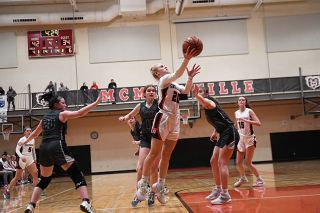 Rusty Rae/News-Register##McMinnville junior guard Peyton Justice drives the lane for a two-pointer against Forest Grove Tuesday evening. Justice finished with a team-high 21 points. Madison Gerhart added 12 points working inside against the Vikings. McMinnville topped the Vikings 59-51 for their fourth straight win. Rusty Rae/News-Register##McMinnville junior guard Peyton Justice drives the lane for a two-pointer against Forest Grove Tuesday evening. Justice finished with a team-high 21 points. Madison Gerhart added 12 points working inside against the Vikings. McMinnville topped the Vikings 59-51 for their fourth straight win.