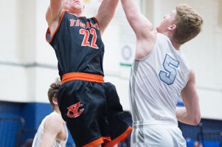 Marcus Larson/News-Register##
Yamhill-Carlton post player Trey Richmond rises for a jump shot over Blanchet Catholic’s Kalvin Sindlinger during Friday’s 74-48 Tiger loss. Richmond led the Tigers with 20 points. Marcus Larson/News-Register##
Yamhill-Carlton post player Trey Richmond rises for a jump shot over Blanchet Catholic’s Kalvin Sindlinger during Friday’s 74-48 Tiger loss. Richmond led the Tigers with 20 points.