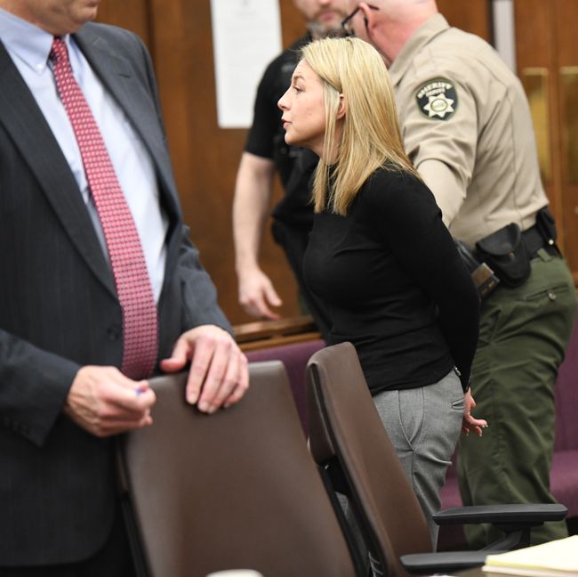 Rusty Rae/News-Register##A handcuffed Jennifer Weathers is led out of the courtroom and to the Yamhill County Jail where she will serve time.