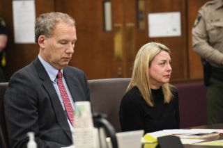 Rusty Rae/News-Register##Jennifer Weathers is seated with her attorney, Walter Todd of Salem, during Tuesday morning s plea and sentencing hearing.