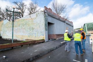 Marcus Larson/News-Register ## Sheridan Public Works Director Kal Cottam, public works employee David Shenk and Curt Edmondson of Sheridan Bridge Investments Llc spend Tuesday inspecting the historic Masonic Lodge building that partially collapsed last Sunday morning.