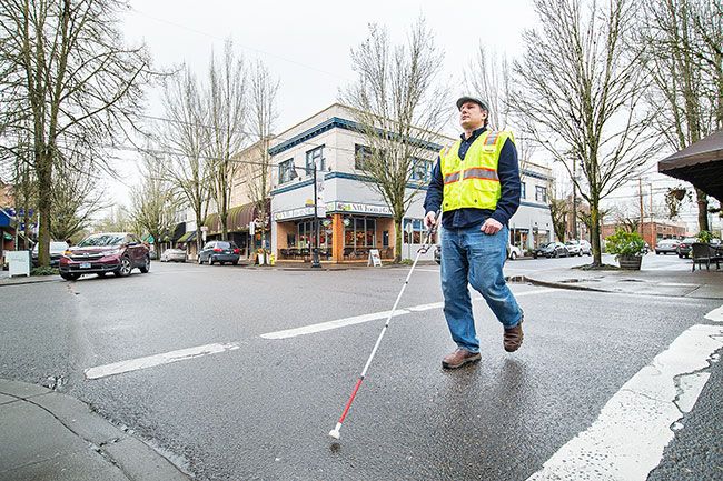 Marcus Larson/News-Register ## Josh Alvey has been learning to navigate the downtown area with a white cane. A condition called retinitis pigmentosa has caused a slow loss of eyesight since he was a child. He became legally blind by his early 20s; now, at 41, he has less than 5% of his total vision — “like looking through pinholes,” he said.