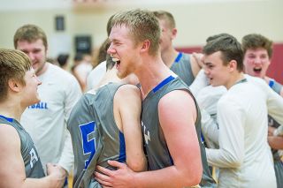 Marcus Larson/News-Register##
Amity’s Tyler Parr (center) embraces teammates Michael Duncan (5) and West Streeter following the Warriors’ 70-64 upset win over Dayton. Parr scored 18 points and grabbed nine rebounds in the victory. Marcus Larson/News-Register##
Amity’s Tyler Parr (center) embraces teammates Michael Duncan (5) and West Streeter following the Warriors’ 70-64 upset win over Dayton. Parr scored 18 points and grabbed nine rebounds in the victory.