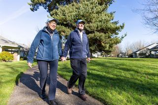 Marcus Larson/News-Register##Linda and Don Gilbert take one of their daily walks around the Hillside Retirement community campus. The Gilberts have been married for 58 years.