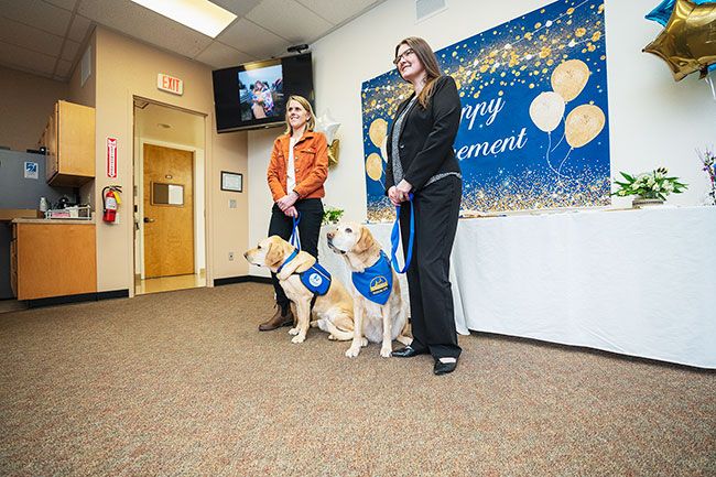 Rachel Thompson##Juliette s House comford dog, Mac, and handler Julie Siepmann, left, helped send former Yamhill County Courthouse Facility dog Marybeth, off into retirement. Her handler for nine years was Crime Victim Services Supervisor Sarah Grabner.