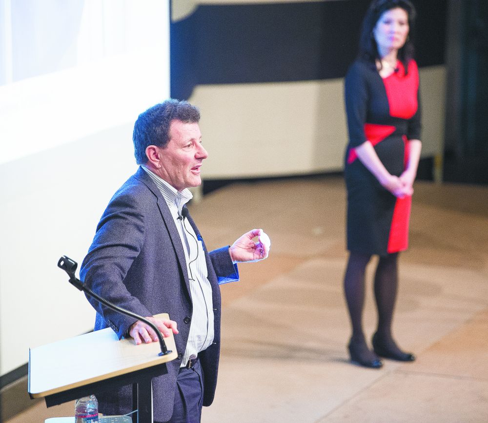 News-Register file photo##Nick Kristof and his wife Sheryl WuDunn speak at the McMinnville Community Center in February 2020.