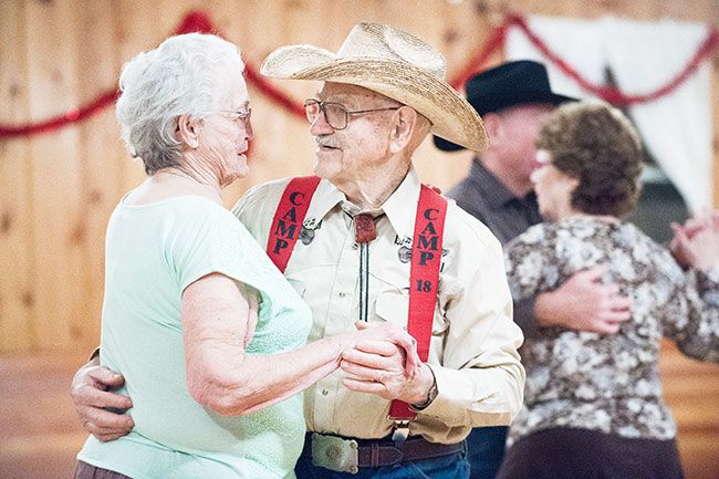 Marcus Larson/News-Register##Stephen and Gladys (Pyne) Cone slow dance during the weekly get-together at the Grange. They met there May 2, 2014, and married May 2, 2015 -- one of many couples who found romance at the Grange.