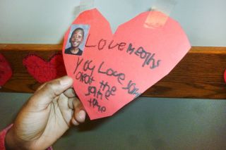 Starla Pointer / News-Register##
Dereon Froembling holds the red heart on which he wrote his definition of love:  Love means you love and get love at the same time. 