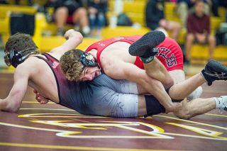Marcus Larson/News-Register##
McMinnville’s Tyler Olsen grapples with Sherwood’s Clayton Wengert during Saturday’s Pacific Conference district meet. Olsen won the match with a 10-4 decision and ultimately finished second at 138 pounds. He will join five other Grizzlies at the state tournament this weekend in Portland. Marcus Larson/News-Register##
McMinnville’s Tyler Olsen grapples with Sherwood’s Clayton Wengert during Saturday’s Pacific Conference district meet. Olsen won the match with a 10-4 decision and ultimately finished second at 138 pounds. He will join five other Grizzlies at the state tournament this weekend in Portland.